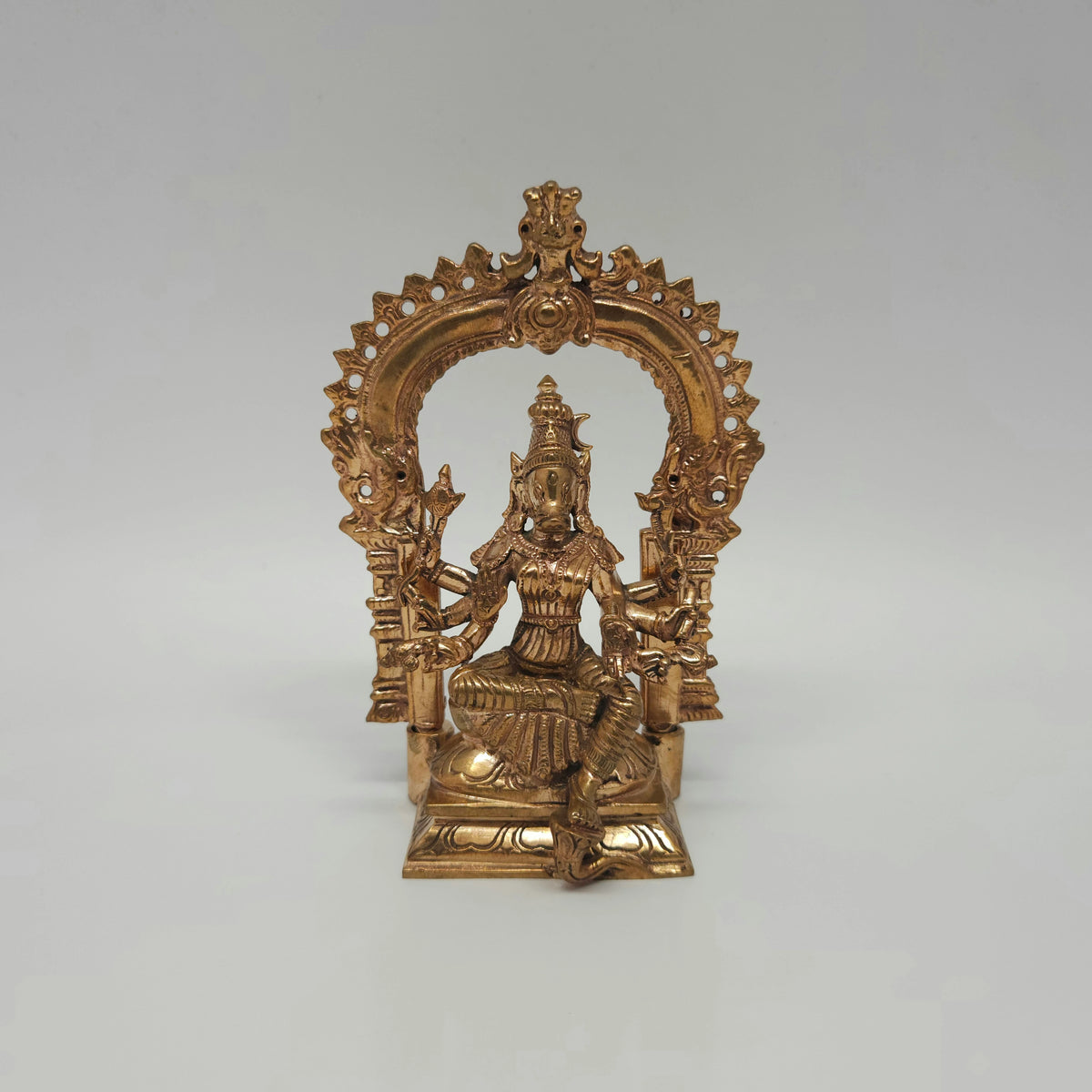 Straight front view of the 12.5cm handcrafted Panchaloha Varahi Amman statue showing the fully assembled aura arch and eight arms by Sri Swaminathan and Co.