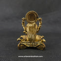 Direct straight back view of the solid brass Lakshmi statue on a hamsa throne demonstrating the detailed rear surface of the sunburst halo crown and back hair arrangement.
