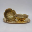 Arranged presentation view displaying two 12.5cm floral engraved brass bowls on a decorative serving tray highlighting the inner mandala patterns and scalloped loop rim.