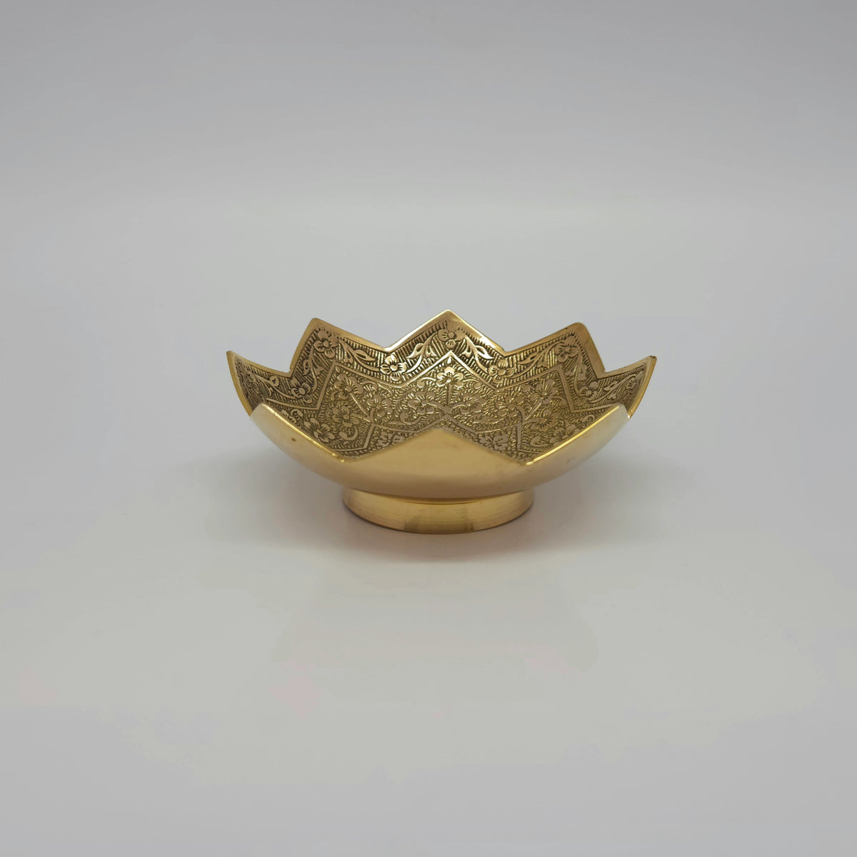 Straight front profile view of a single 10cm intricate floral lotus blossom brass bowl showcasing the high-gloss mirror polished pedestal foot base by Sri Swaminathan and Co.