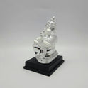 Right side view of the 7.5 inch silver accents resin Ganesha figurine displaying the elegant depth of the seating posture.