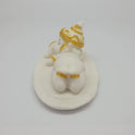 Full back view of the 2.8 inch reclining marble-like Ganesha idol demonstrating its perfect proportions for car dashboard placement.