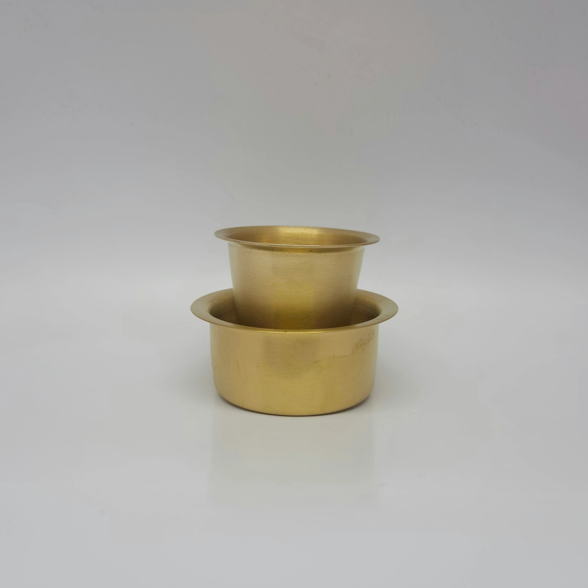 Straight view of the traditional brass filter coffee set showing the 160ml tumbler standing upright inside the 190ml davara bowl