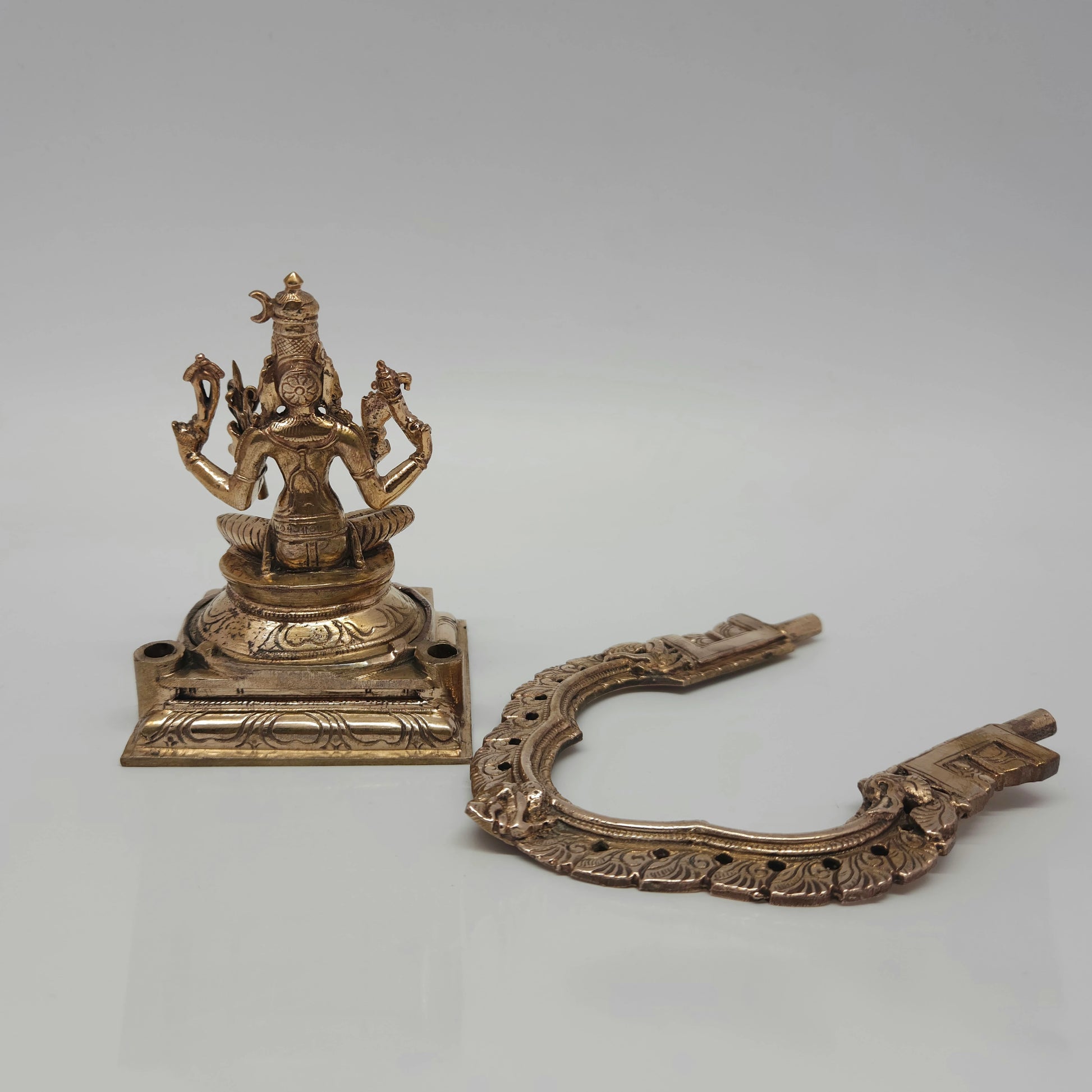 Prabhavali Lying perspective view of the 500 grams raw Panchaloha Goddess Rajarajeshwari statue highlighting the clean metal casting textures.