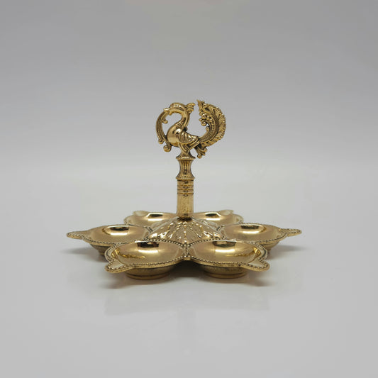 Side view look of the pure brass multi-agal peacock lamp on a white background.
