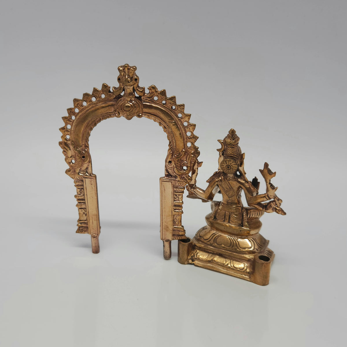 Back Side angle presentation view showcasing the 12.5cm Panchaloha Varahi Amman statue with the Prabhavali aura arch completely removed from the base slots for cleaning.