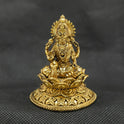 Straight front view of the premium solid brass Aishwarya Lakshmi statue showing the goddess seated on a circular lotus base pouring gold coins from a pot by Sri Swaminathan and Co.