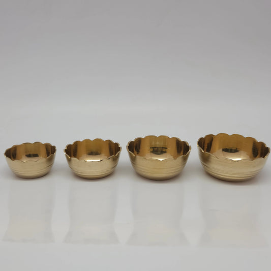 Direct straight front view of the premium solid brass bloom lotus katori bowl set showcasing the mini small big and large size variants arranged in a horizontal row by Sri Swaminathan and Co.
