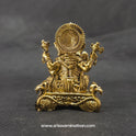 Direct straight back view of the solid brass Ganesha statue highlighting the reverse details of the sunburst halo crown and the rough hard-faced hamsa birds on the throne base.