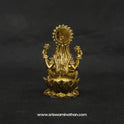 Direct straight back view of the solid brass Kubera Lakshmi statue demonstrating the detailed rear surface of the halo crown and lengthy hair curls over the base.
