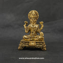 Straight front view of the premium solid brass Lakshmi statue showing the goddess seated in Padmasana on a flower decorated base with an Akshaya Patra vessel by Sri Swaminathan and Co