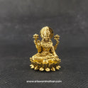 Straight front view of the premium solid brass Lakshmi statue showing the goddess in her actual real form seated in Padmasana on a double-bloomed round lotus peedam by Sri Swaminathan and Co.