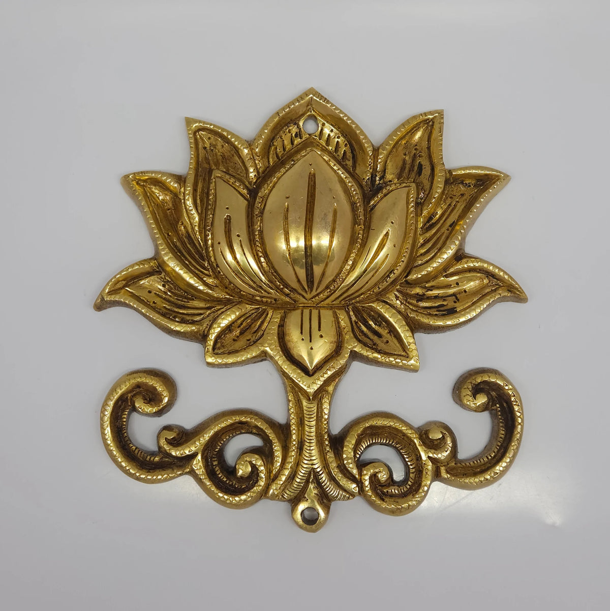 Direct straight front profile view of the premium solid brass lotus medallion wall decor showing the top and bottom screw mounting holes by Sri Swaminathan and Co.
