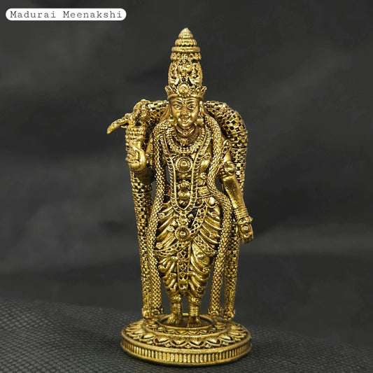 Straight front view of the premium solid brass Madurai Meenakshi amman statue showing the goddess standing with her sacred parrot on a round lotus peedam base by Sri Swaminathan and Co.
