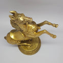 Tilted overhead top view looking down at the pure brass rearing horse statue to showcase the balance of the upper body and base diameter width.