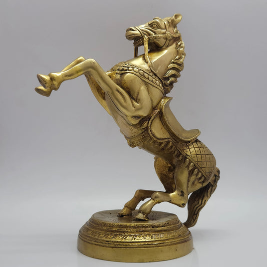 Right side profile view of the premium solid brass rearing horse vastu statue showcasing the dynamic leg muscles and circular pedestal base by Sri Swaminathan and Co.
