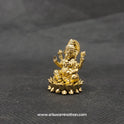 Three-quarter front right perspective view of the one inch brass Ganesha statue showcasing his prominent fat abdomen, the detailed modak, and Mooshikan seated on the round lotus edge.