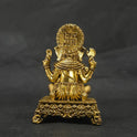 Direct straight back view of the solid brass Ganesha statue on an ornate square pedestal demonstrating the detailed rear surface of the sunburst halo crown and back base contours.