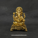 Straight front view of the premium solid brass seated Ganesha statue showing the Lord on an ornate square peedam with Mooshika by Sri Swaminathan and Co