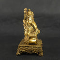 Exact right side profile view of the brass Ganesha statue on a square pedestal showing the clean side contours of his trunk, fat abdomen, and the detailed crown profile.