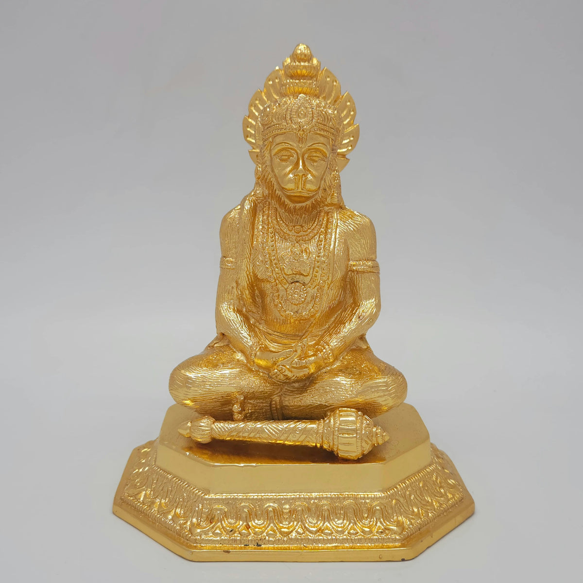 Direct straight front view of the premium solid brass meditating Lord Hanuman statue in gold powder coated glossy finish by Sri Swaminathan and Co.