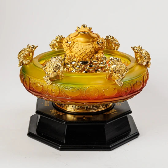 28cm premium gold paint finish resin rotating Feng Shui money frog wealth basin with six outer toads over a frosted Liuli glass style bowl on a black octagonal Bagua pedestal base by Sri Swaminathan and Co