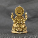 Direct straight back view of the one point seven five inch solid brass Ganesha statue demonstrating the detailed rear surface of the sunburst halo crown and back base curves.