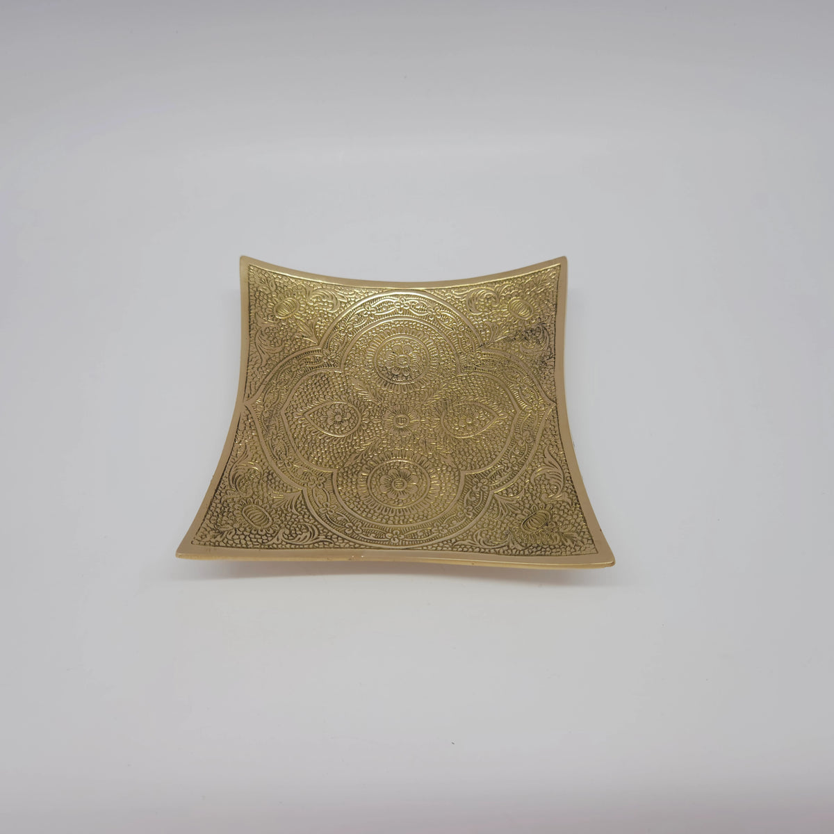 Three-quarter perspective front view of a single 12.5cm royal square mandala brass feast bowl highlighting its sweeping concave walls by Sri Swaminathan and Co.