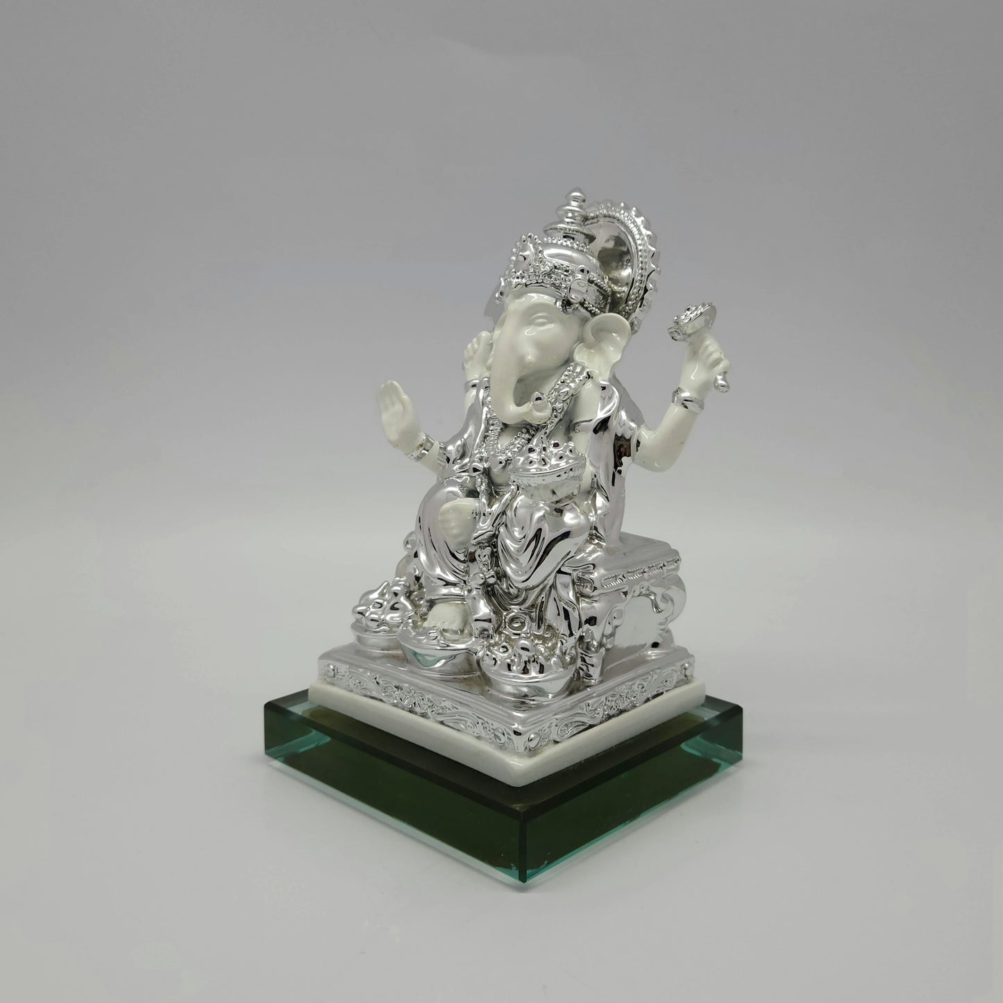 Right perspective view highlighting the detailed scrollwork on the silver-toned throne and the smooth satin white marble-look body