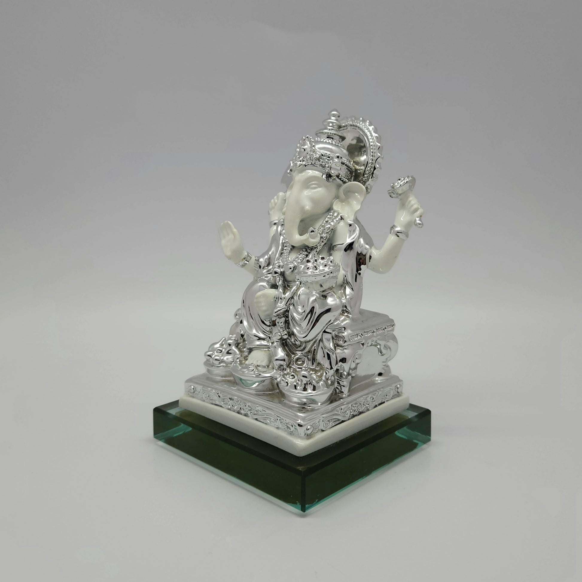 Right perspective view highlighting the detailed scrollwork on the silver-toned throne and the smooth satin white marble-look body