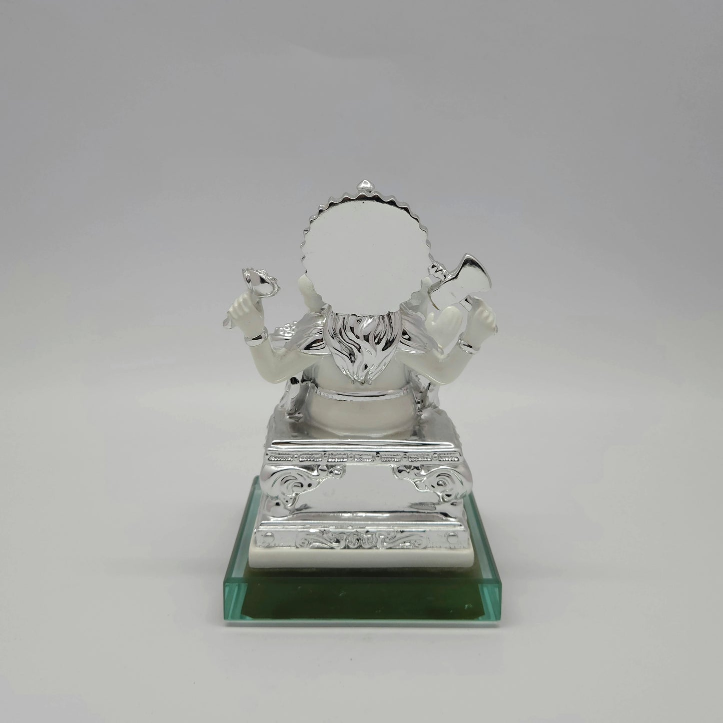 Full back view of the metallic silver painted throne and circular back halo mounted securely onto the premium square glass base.