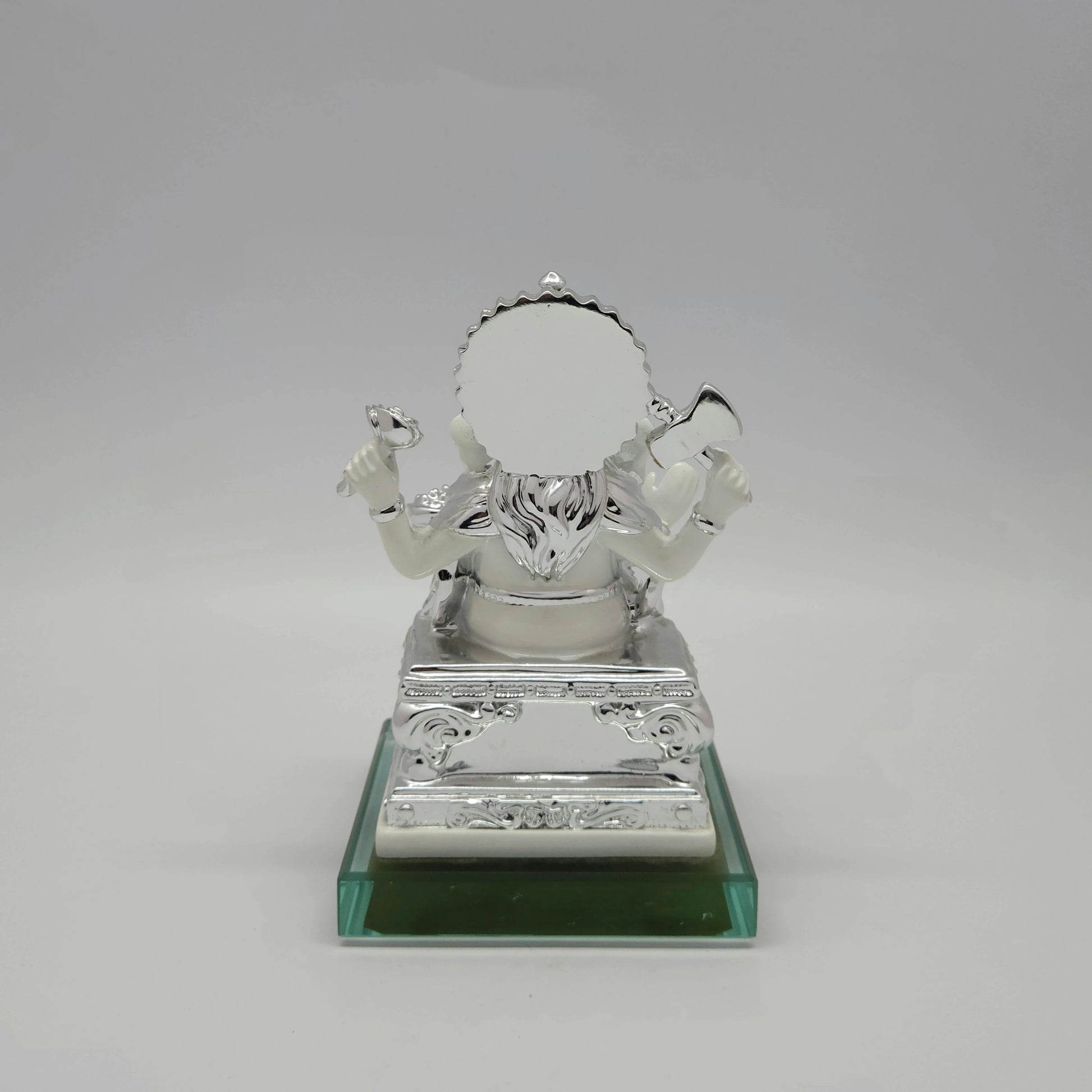 Full back view of the metallic silver painted throne and circular back halo mounted securely onto the premium square glass base.