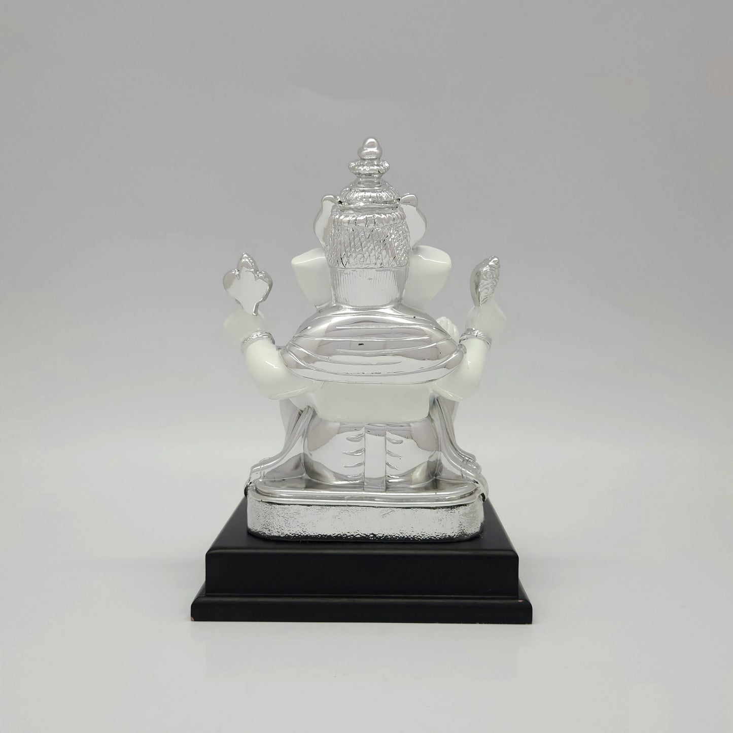 Full back view of the white marble texture resin Ganesha throne showing the clean lines mounted onto the premium black base platform.