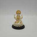 Front view of an 11cm white marble-finish resin Goddess Lakshmi statue seated on a lotus with a circular dark pedestal base by Sri Swaminathan and Co.