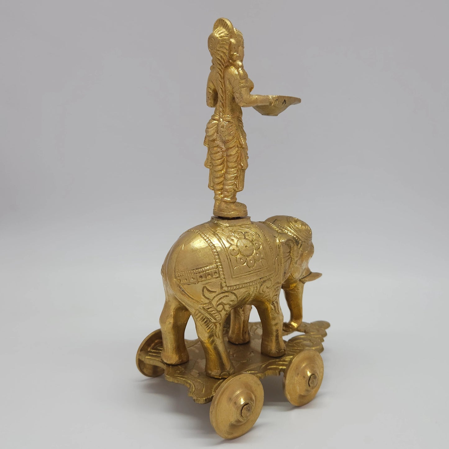 Sri Swaminathan and Co handmade brass Deepalakshmi knotted hair on elephant chariot lamp 10-inch 26cm height back view showing reverse of figure and rolling wheels chassis