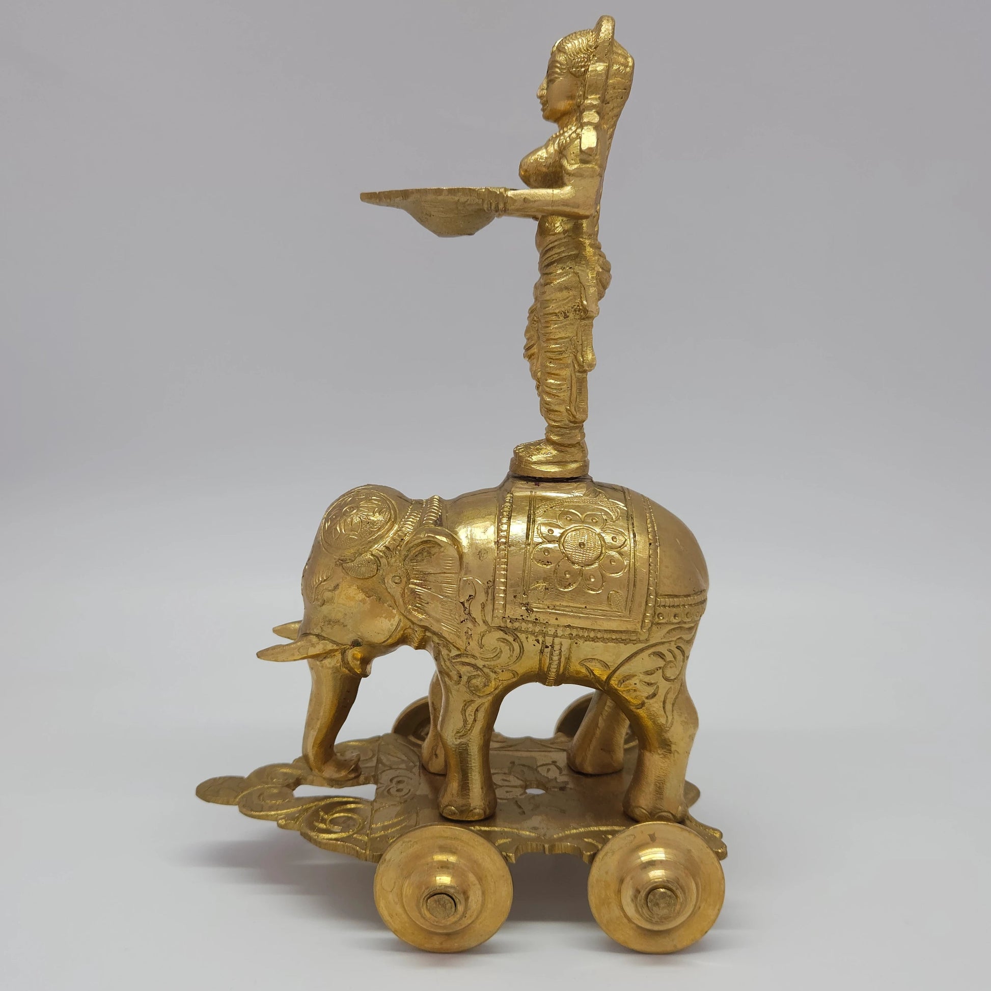 Sri Swaminathan and Co premium handmade brass Deepalakshmi on Gaja chariot vilakku 10-inch 26cm height 16cm length 2.2kg weight right side profile view tracking armor details and handmade wheel configurations