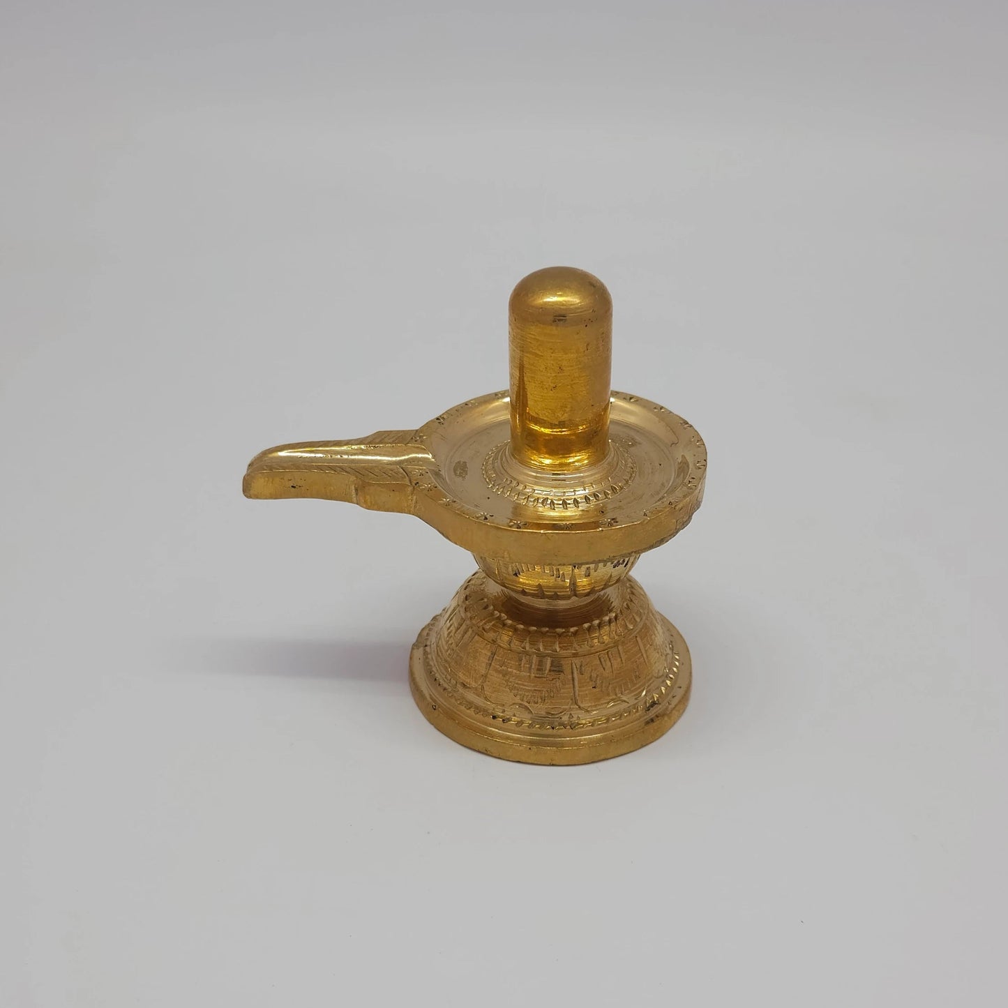 Sri Swaminathan and Co pure brass Shiva Lingam statue 8.5cm height back pose full rear view showing reverse of the round peedam base and smooth lingam cylinder