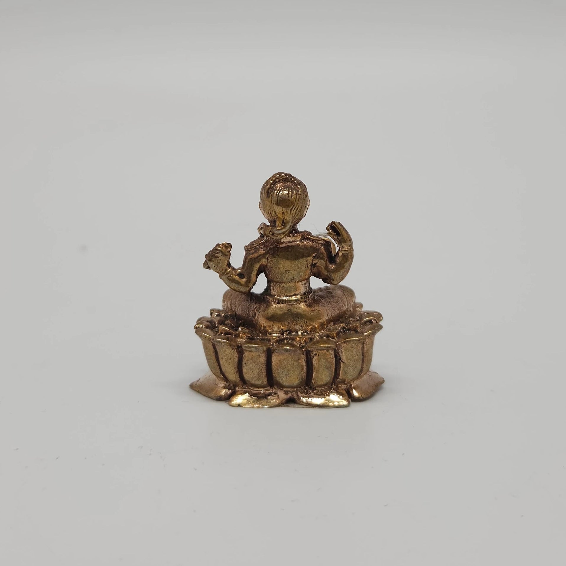Sri Swaminathan and Co handcraft style Panchaloha miniature Balambigai statue 3.5cm height back pose rear view showing reverse profile of the kireetam crown and lotus peedam