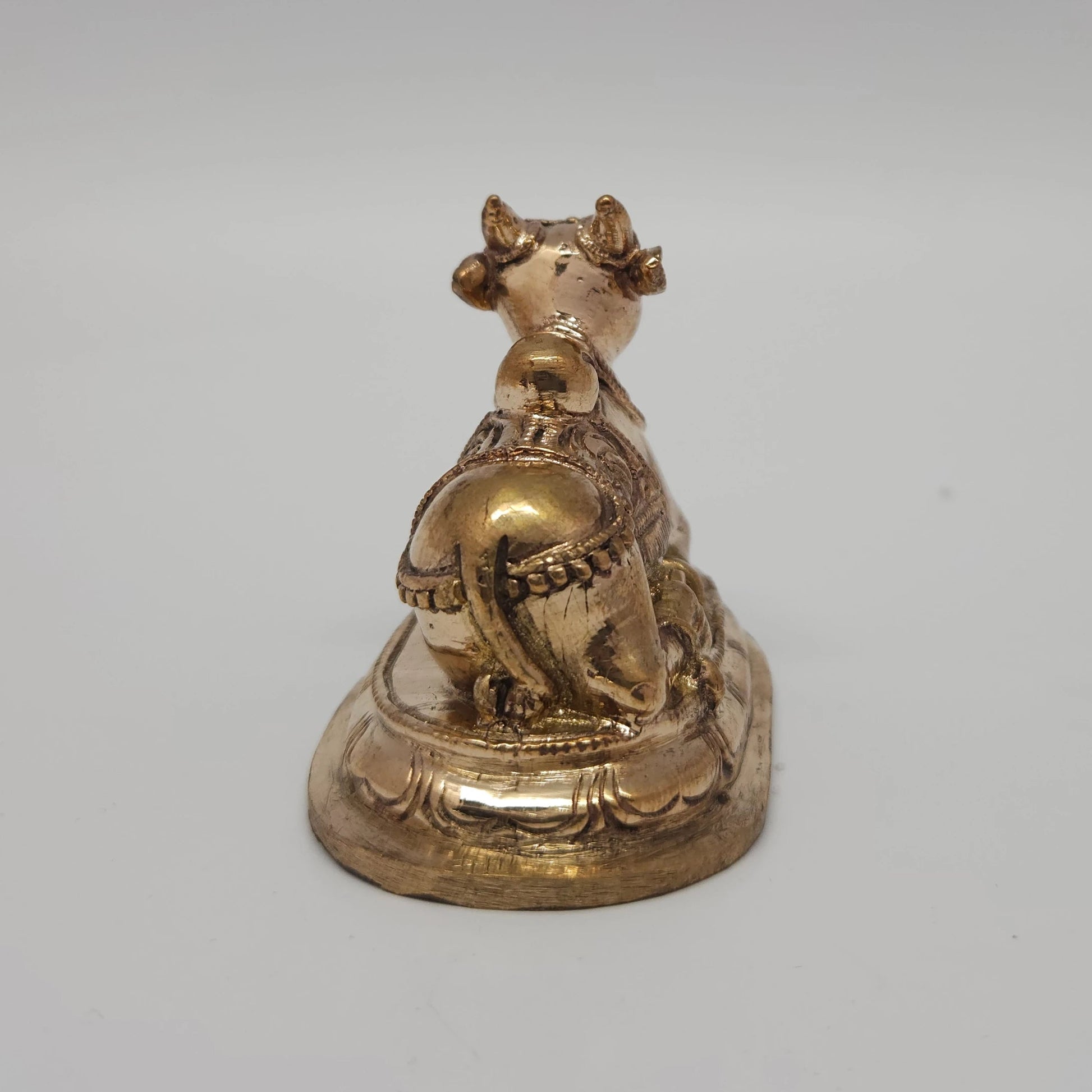 Sri Swaminathan and Co handcraft style Panchaloha Nandi statue 7.5cm length back pose rear view showing reverse profile of tail and back blanket