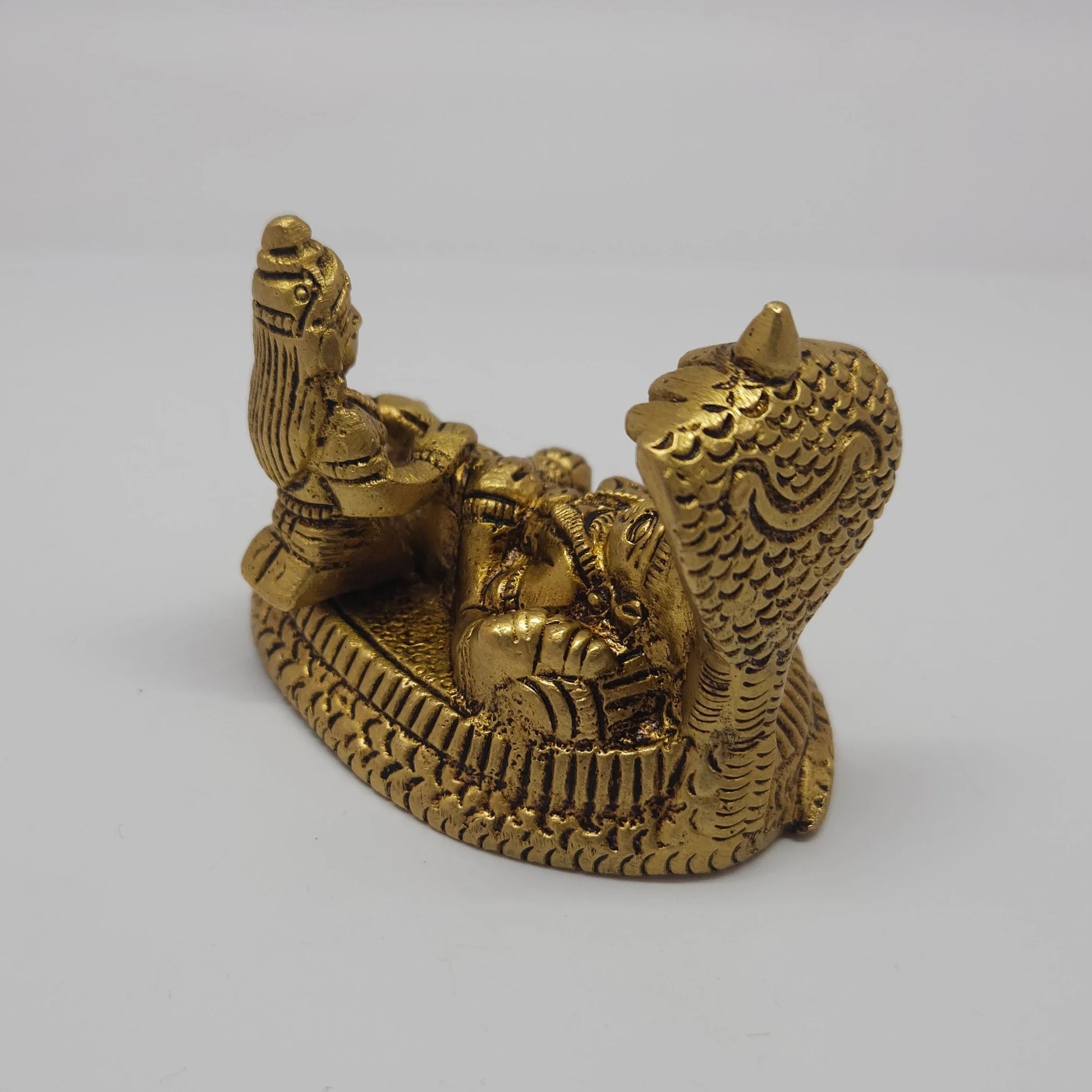 Sri Swaminathan and Co brass Ranganatha perumal statue antique finish 200g weight 45 degree left pose corner view highlighting the chiseled details of the protective serpent canopy hood
