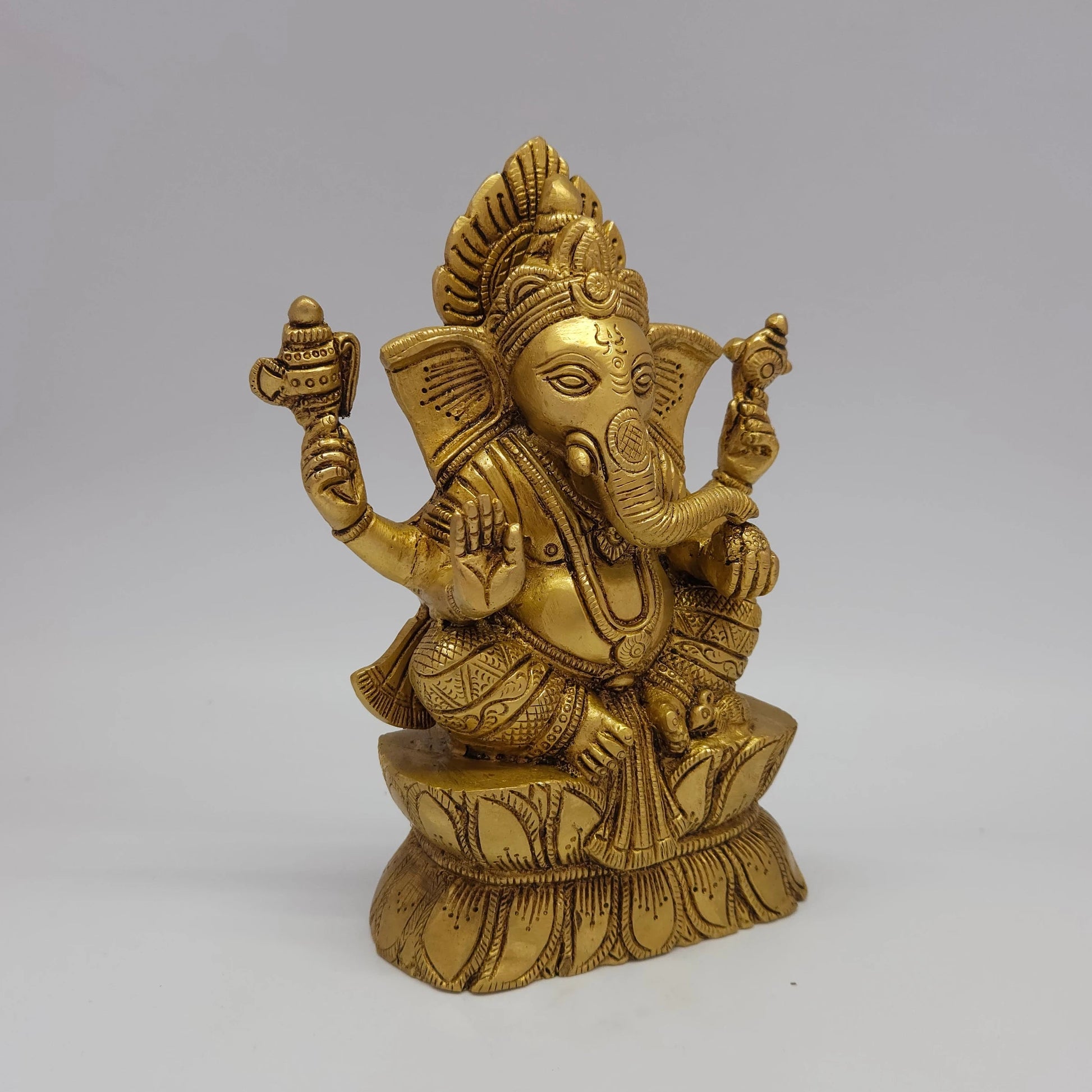 Sri Swaminathan and Co brass Ganesha on lotus pedestal antique finish 1.6kg weight 45 degree right pose corner view focusing on traditional elephant goad tool and mouse details