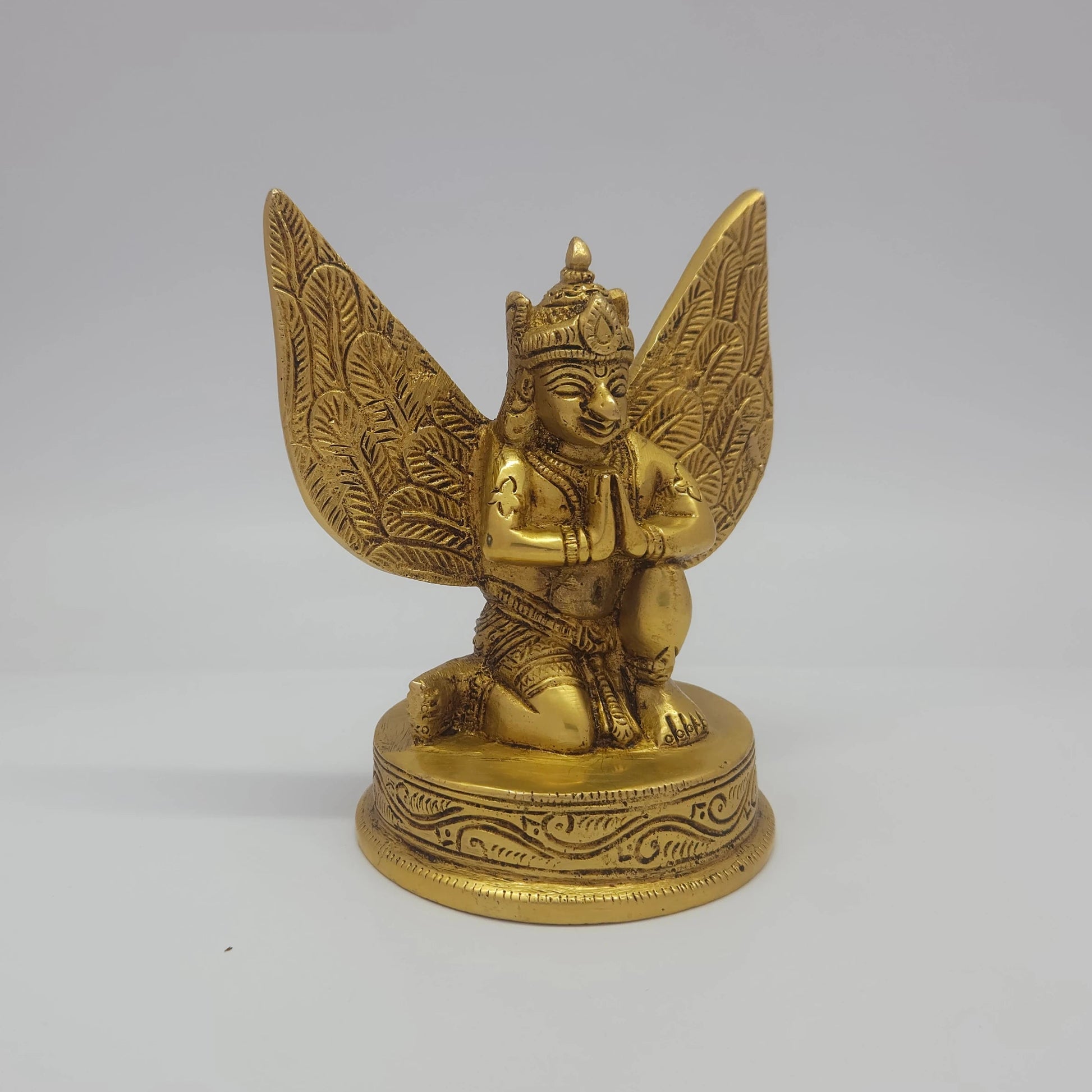 Sri Swaminathan and Co brass Garuda Alwar statue antique finish 1kg weight 45 degree right pose corner view focusing on kneeling garudasan stance and folded hands profile