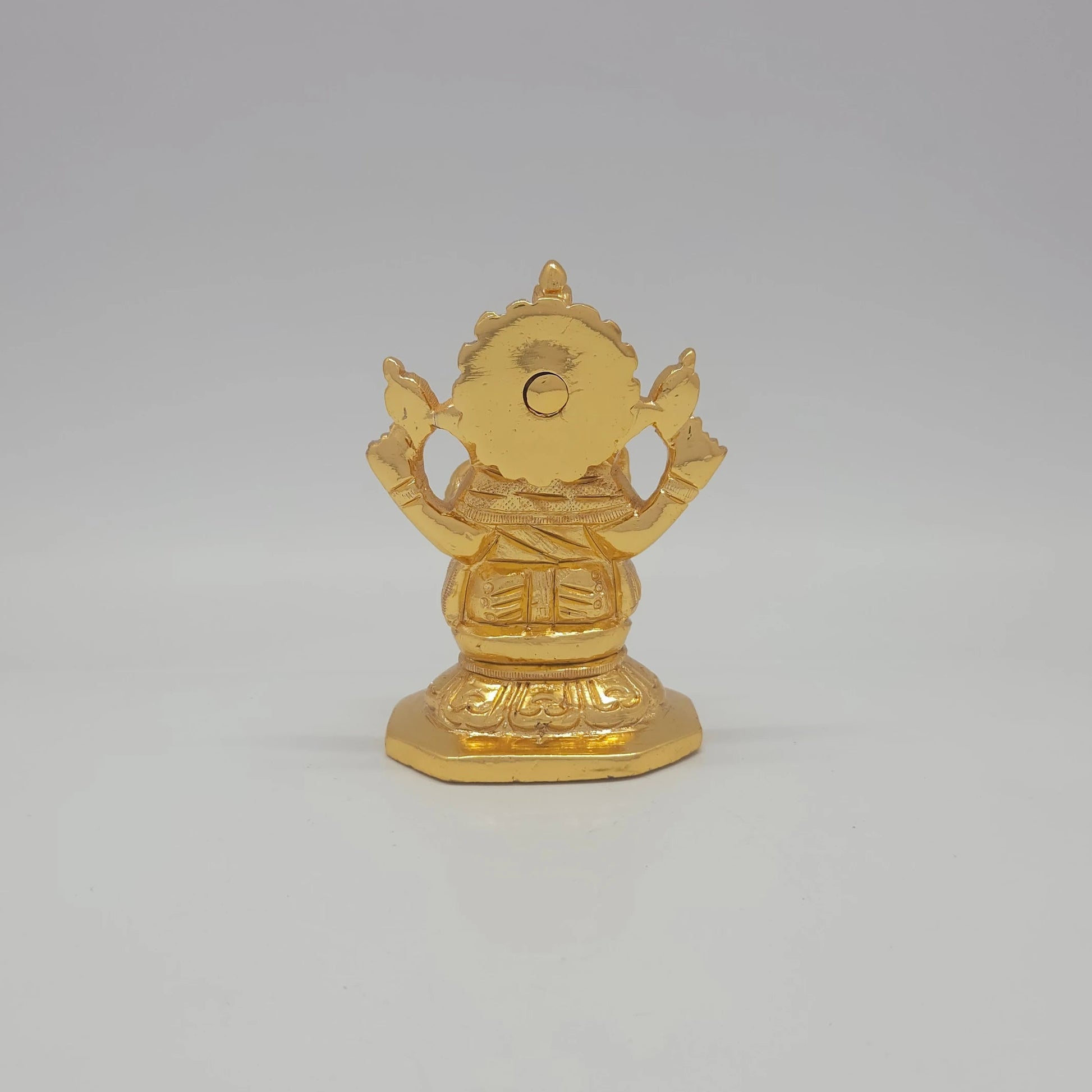 Sri Swaminathan and Co brass miniature Chaturbuja Ganapathi statue gold finish 300g weight back pose full rear view showing reverse of tiered halo crown and octagonal base platform