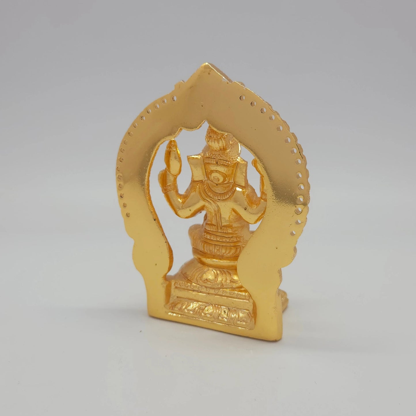 Sri Swaminathan and Co brass miniature Chaturbuja Ganapathi statue gold finish 250g weight 45-degree back pose rear view showing reverse of flat thiruvatchi temple arch frame and rectangular pedestal