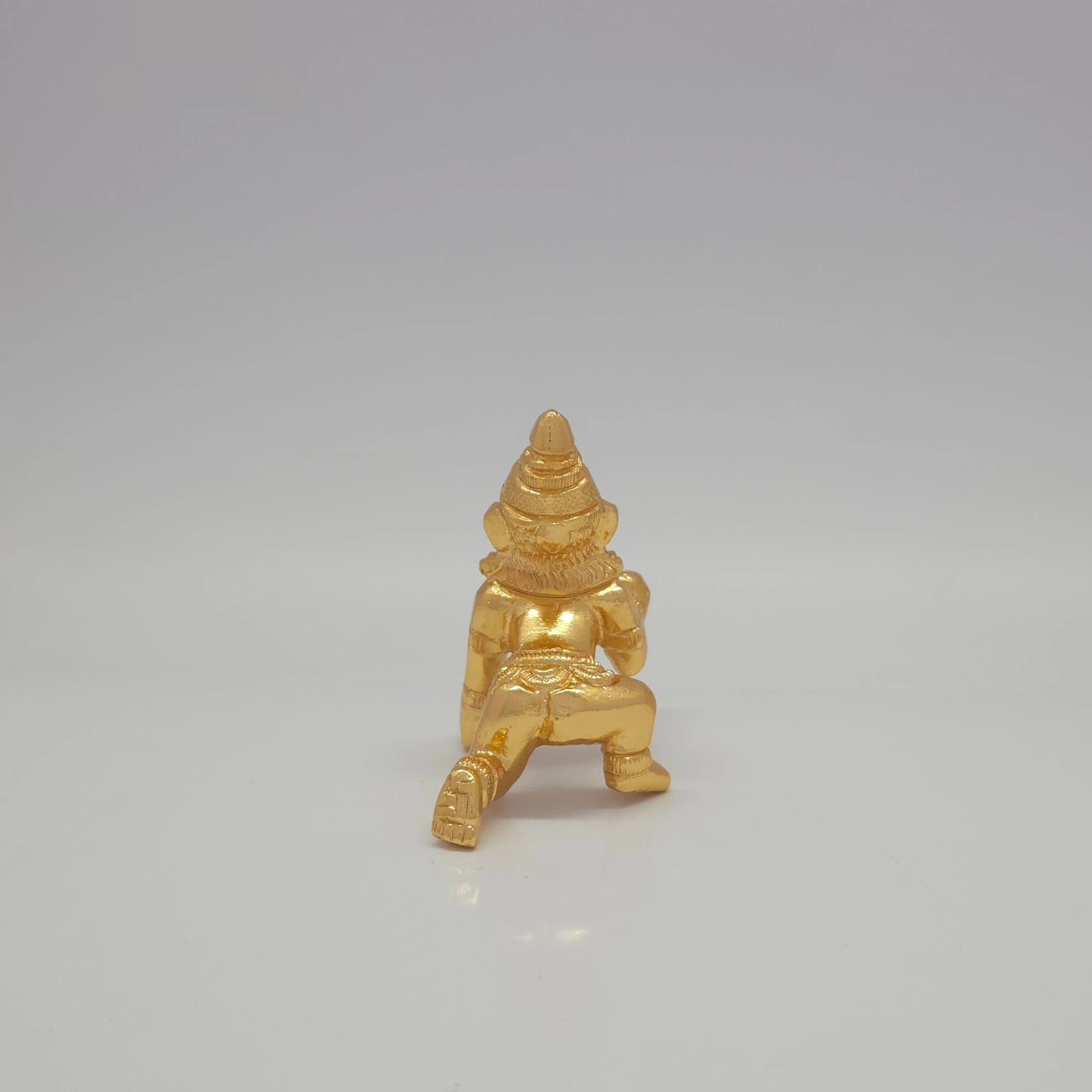 Sri Swaminathan and Co brass crawling Baby Krishna showpiece gold finish 100g weight back pose full rear view showing reverse of tiered crown and crawling legs profile