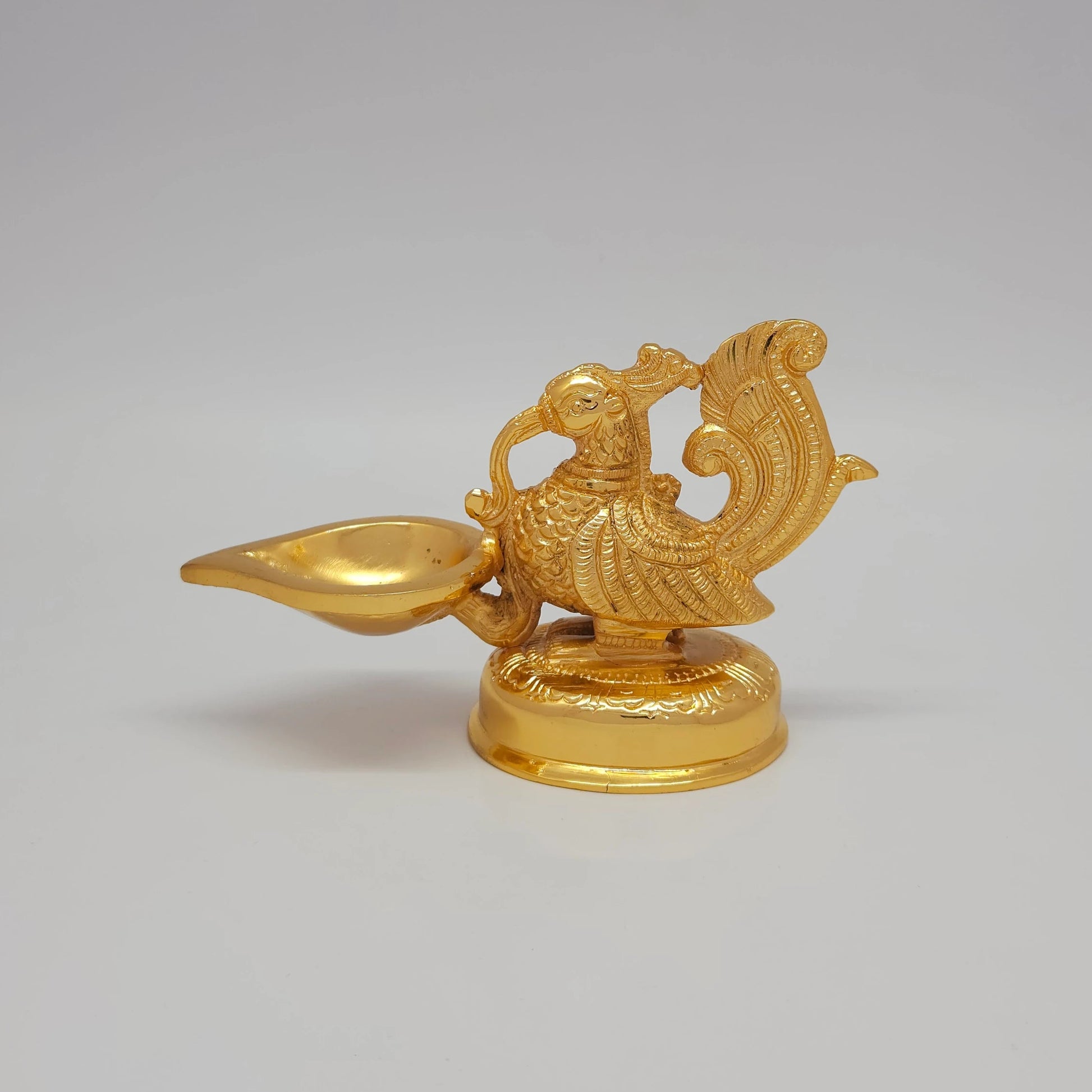 Sri Swaminathan and Co premium brass decorative Mayura peacock diya showpiece sculpture gold powder coated finish 610g weight 16cm length front straight profile view