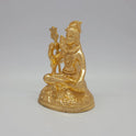 Sri Swaminathan and Co brass miniature seated Shiva statue gold finish 550g weight 45 degree left pose corner view highlighting the trident shaft and damaru drum details