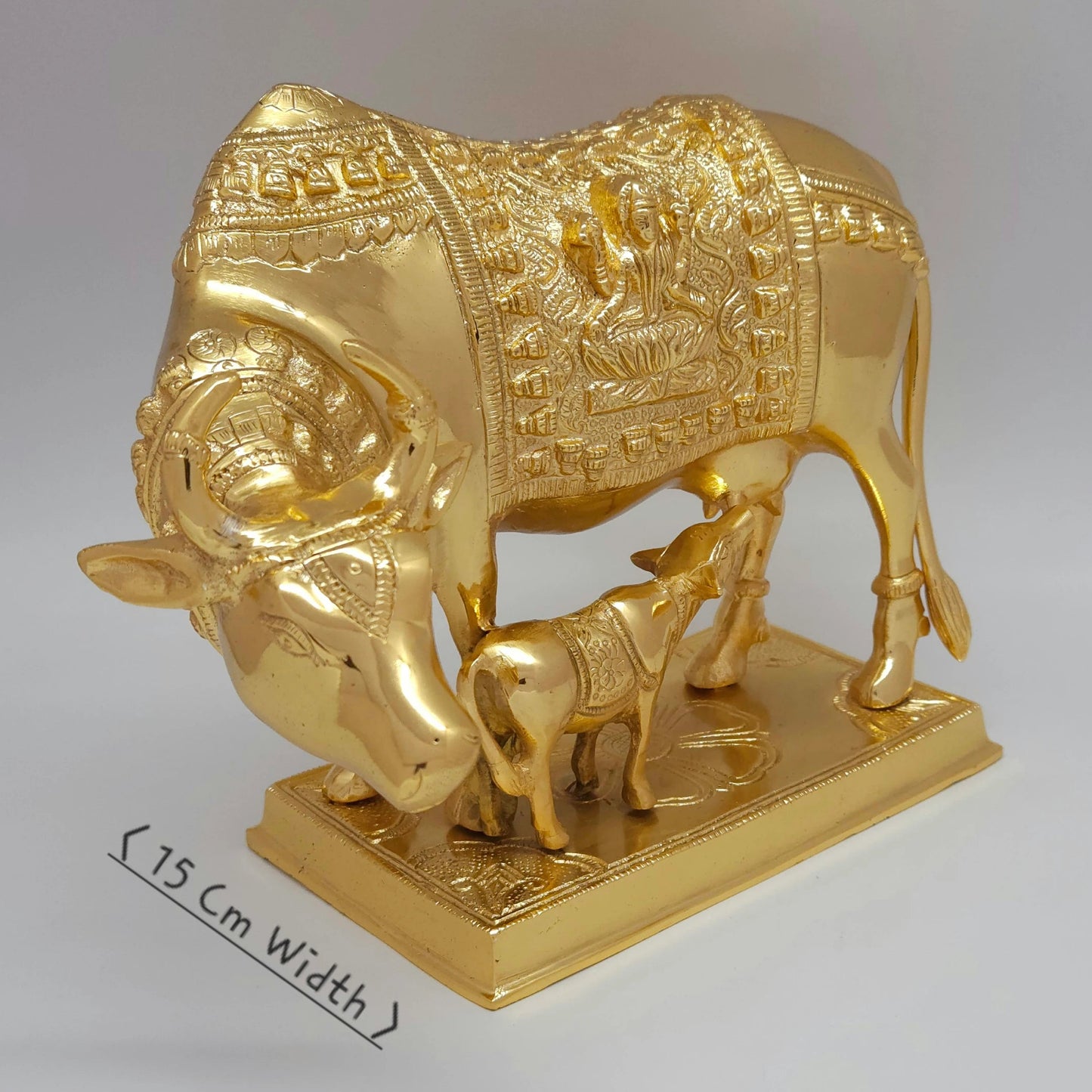 Sri Swaminathan and Co brass grand Kamadhenu cow statue 4.5kg 45 degree left pose corner view highlighting the chiseled neck bell collar and horn detailing