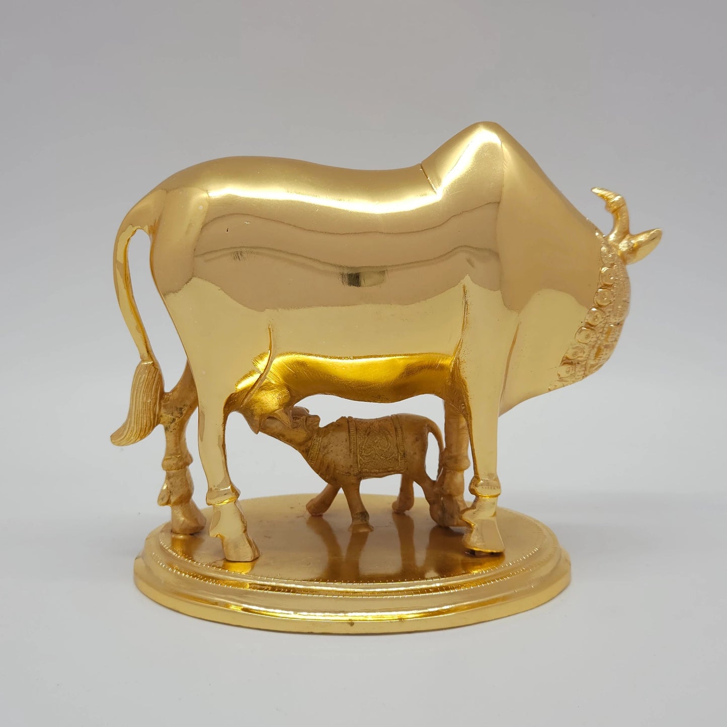 Sri Swaminathan and Co pure brass heavy Kamadhenu cow and calf statue 2.25kg back pose full rear view showing reverse of polished tail and legs