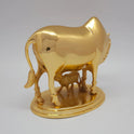 Sri Swaminathan and Co pure brass heavy Kamadhenu cow statue 2.25kg 45 degree right pose corner view focusing on calf drinking milk and base platform depth
